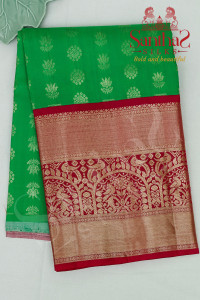 meenakshi-green-colour-body-in-zari-butta-with-contrast-blouse-border