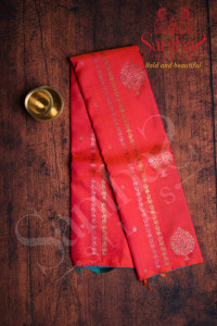 pinkish-orange-colour-body-tree-butta-with-contrast-blouse