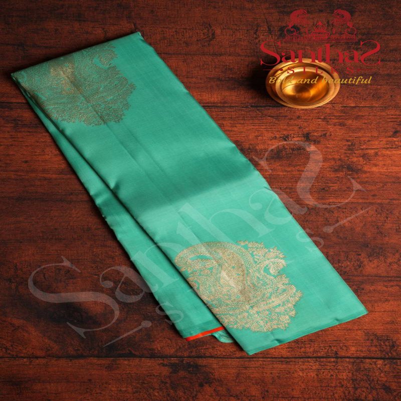 BORDERLESS AQUA BLUE COLOUR BODY WITH BIG MOTIFS AND ORANGISH RED COLOUR CONTRAST BLOUSE