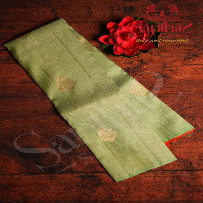 BORDERLESS PASTEL GREEN COLOUR BODY WITH ORANGE THREAD SMALL CHECKED BOXS & SMALL MOTIFS AND ORANGE COLOUR CONTRAST BLOUSE