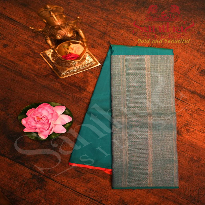 BORDERLESS PEACOCK BLUE COLOUR BODY WITH SILVER ZARI MOTIFS AND CONTRAST BLOUSE