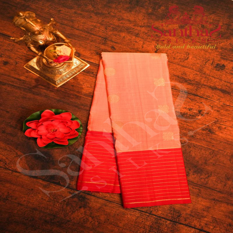 PEACH PINK COLOUR BODY WITH GOLDEN ZARI ANNAM CHAKKARAM MOTIFS AND CONTRAST RED BLOUSE