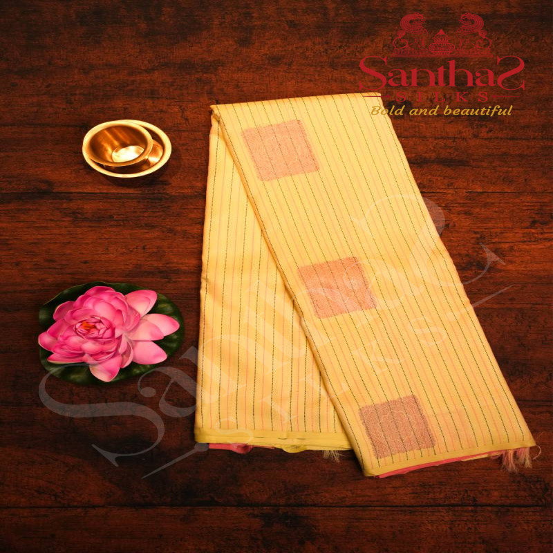 BORDERLESS PASTEL YELLOW COLOUR BODY STRIPS WITH COPPER ZARI MOTIF AND CONTRAST BLOUSE