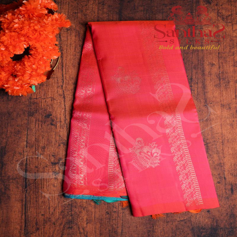 PINKISH ORANGE COLOUR BODY COPPER ZARI BUTTA WITH CONTRAST BLOUSE