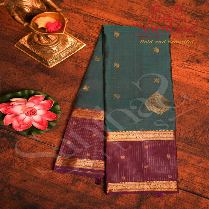 PEACOCK BLUE COLOUR BODY WITH GOLDEN ZARI FLOWER BUTTAS AND PURPLE COLOUR CONTRAST BLOUSE