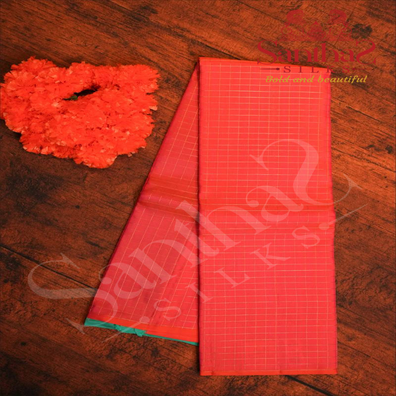 BORDERLESS ORGANISH PINK COLOUR BODY WITH GOLDEN ZARI CHECKED BOXS AND CONTRAST BLOUSE