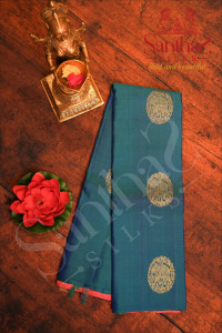 borderless-peacock-blue-colour-body-with-golden-zari-elephant-motifs-and-contrast-blouse