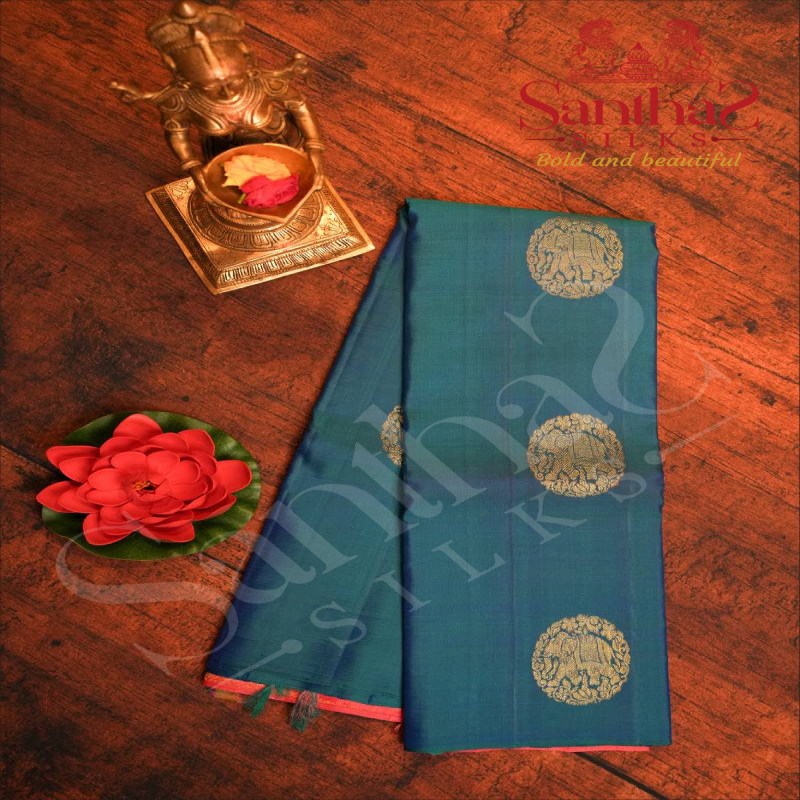 BORDERLESS PEACOCK BLUE COLOUR BODY WITH GOLDEN ZARI ELEPHANT MOTIFS AND CONTRAST BLOUSE