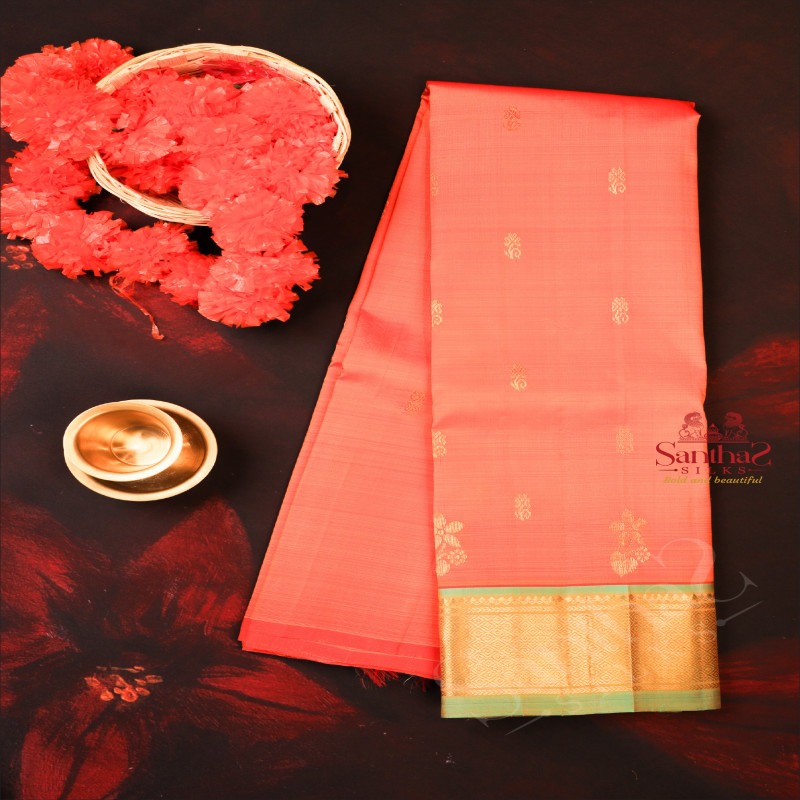 ORANGISH RED COLOUR BODY WITH GOLDEN ZARI BUTTAS & SINGLE SIDE BORDER AND CONTRAST PALLU WITHOUT BLOUSE