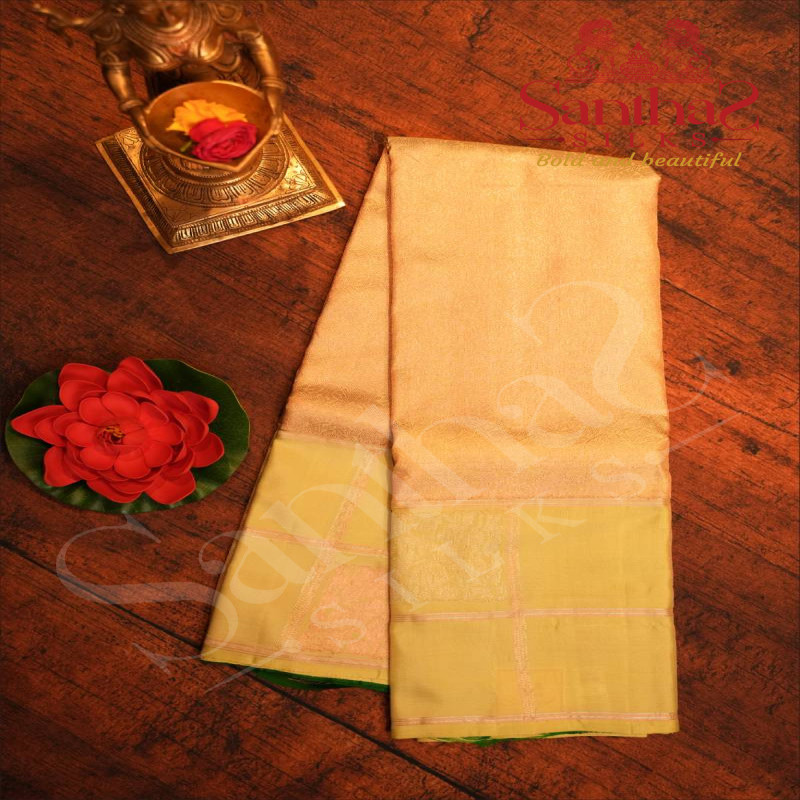 TEA GREEN COLOUR BODY WITH COPPER & SILVER ZARI FLOWER DESIGN AND CONTRAST BLOUSE