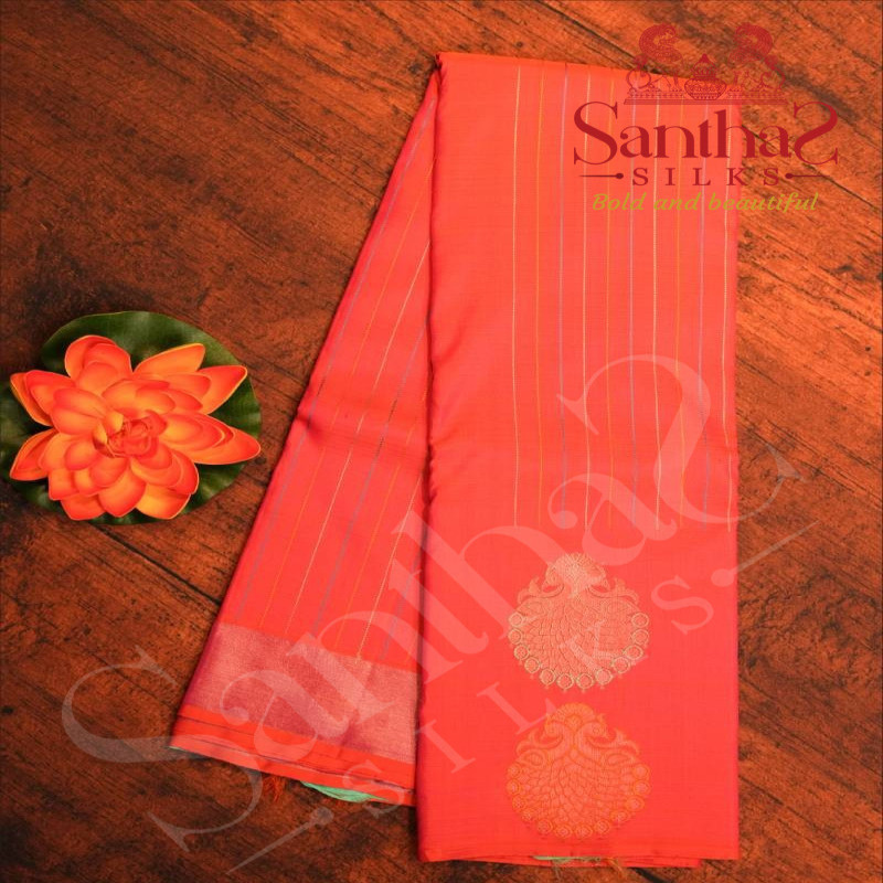 BORDERLESS ORANGISH PINK COLOUR BODY WITH MULTI COLOUR STRIPS & PEACOCK MOTIFS AND CONTRAST BLOUSE