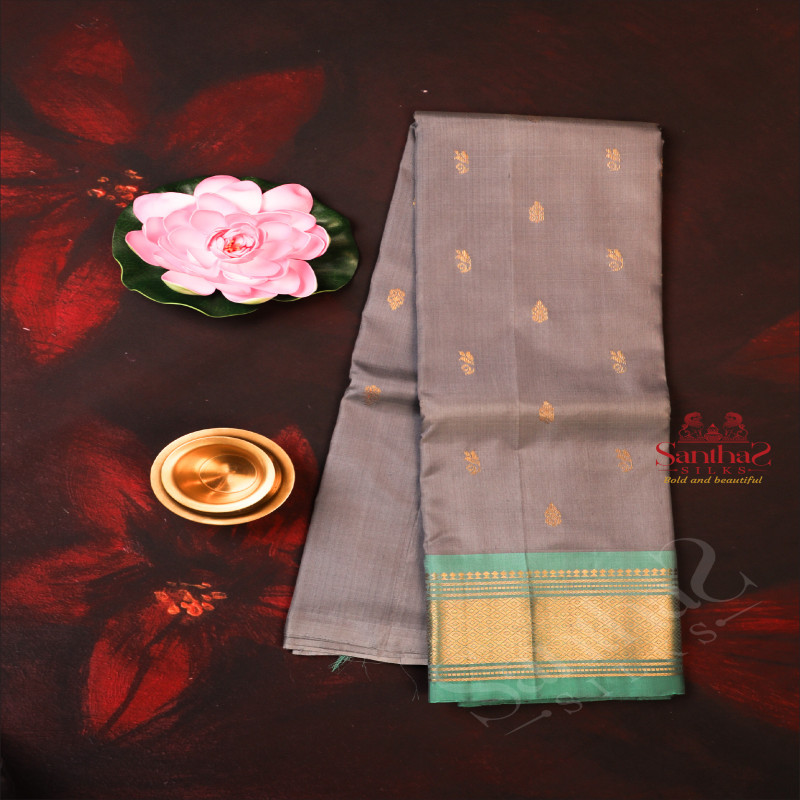 ONESIDE BORDER GRAY COLOUR BODY WITH GOLDEN ZARI BUTTA & WITHOUT BLOUSE