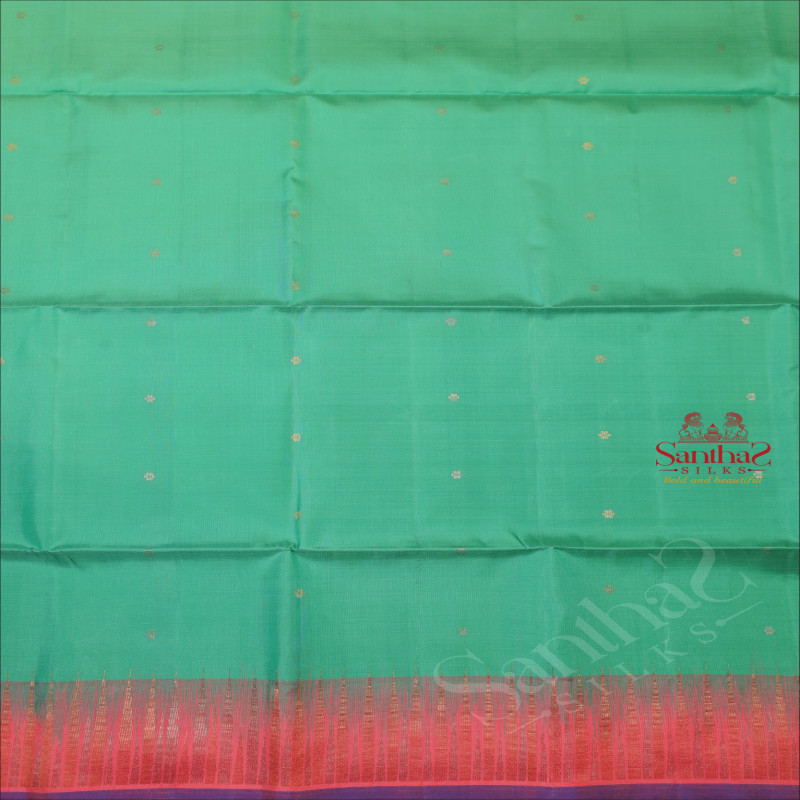 MINT GREEN COLOUR BODY WITH SILVER ZARI STRIPS AND BUTTA WITH CONTRAST BLOUSE & BORDER