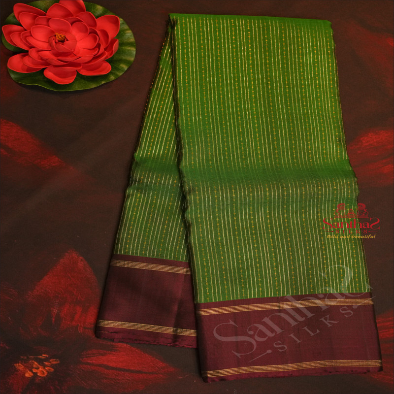 BOTTLE GREEN COLOUR BODY WITH SILVER & GOLD ZARI STRIPS AND CONTRAST COLOUR BLOUSE AND PALLU