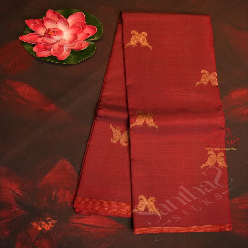 MAROON COLOUR BODY WITH GOLDEN ZARI PARROT MOTIFS AND CONTRAST COLOUR BLOUSE AND PALLU