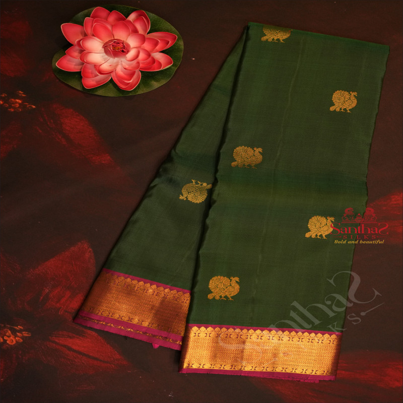 FOREST GREEN COLOUR BODY WITH GOLDEN ANNAM CHAKKARAM BUTTA WITH CONTRAST BLOUSE & BORDER