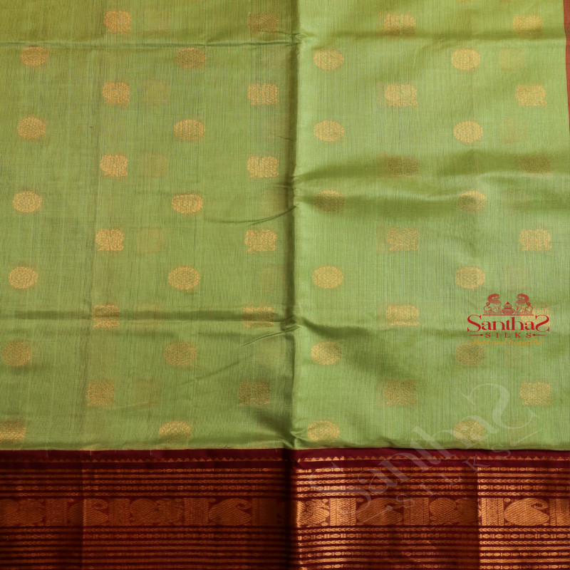 PISTHA GREEN COLOUR BODY WITH GOLDEN ZARI CHAKKARAM BUTTA WITH CONTRAST BLOUSE & BORDER