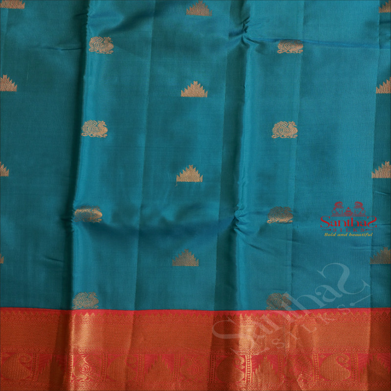 CYAN BLUE COLOUR BOFY WITH GOLDEN ZARI ANNAM AND TEMPLE BUTTA WITH CONTRAST BLOUSE & BORDER