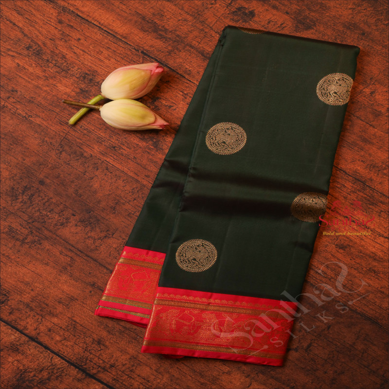 BOTTLE GREEN BODY WITH GOLDEN ZARI CHAKKARAM BUTTA WITH CONTRAST BLOUSE & BORDER