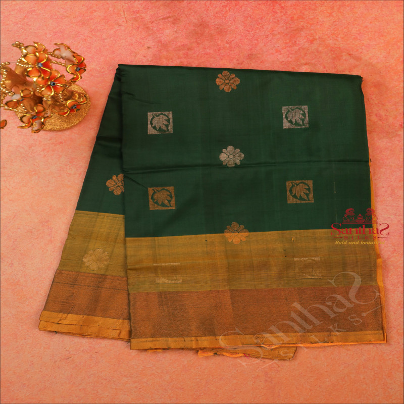 BOTTLE GREEN COLOUR BODY WITH GOLDEN AND SILVER ZARI LEAF FLOWER BUTTA WITH CONTRAST BLOUSE & BORDER