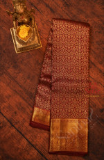 MAROON COLOUR BODY WITH GOLDEN FLORAL BUTTA WITH SELF BLOUSE & BORDER