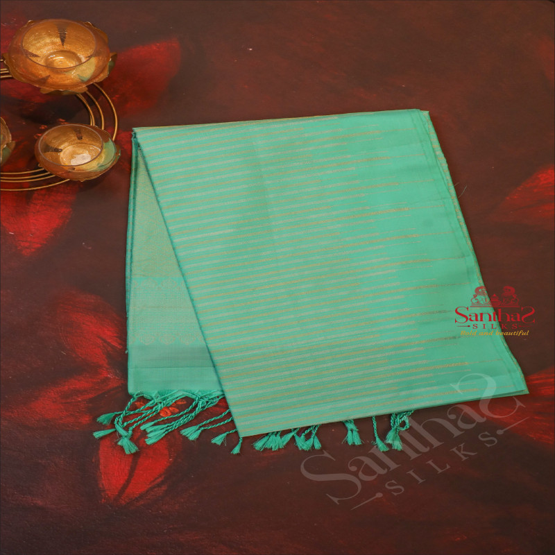 TURQUOISE BLUE COLOUR BODY WITH GOLDEN & SILVER ZARI STRIP LINES AND SELF COLOUR PALLU & BLOUSE