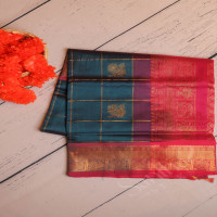 peacock-blue-colour-checked-body-with-golden-zari-annam-butta-with-contrast-blouse-border