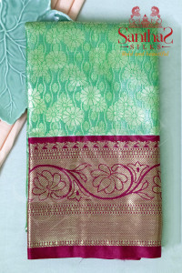 green-colour-tissue-body-in-floral-pattern-with-contrast-blouse-border