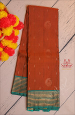 BURNT ORANGE COLOUR BODY WITH GOLDEN ZARI PEACOCK BUTTA WITH CONTRAST BLOUSE & BORDER