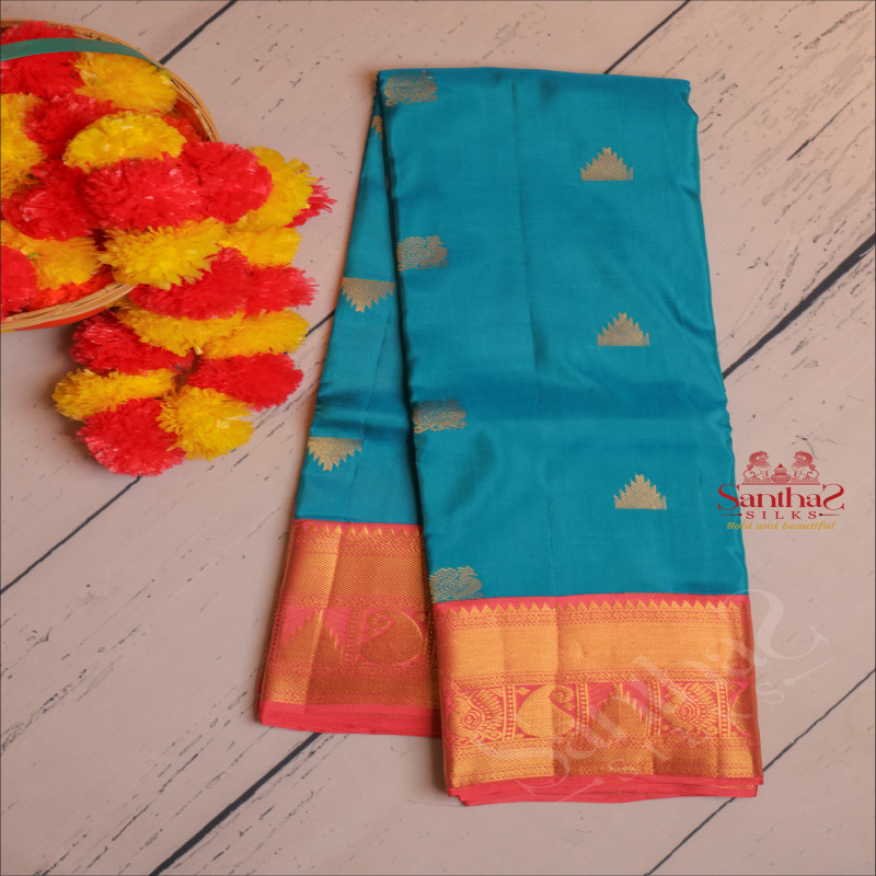 CYAN BLUE COLOUR BOFY WITH GOLDEN ZARI ANNAM AND TEMPLE BUTTA WITH CONTRAST BLOUSE & BORDER