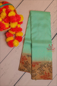 medium-aquamarine-blue-colour-body-with-golden-zari-embosed-with-contrast-blouse-border