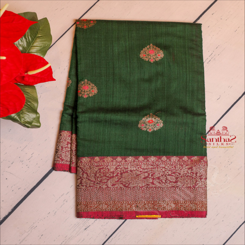 BOTTLE GREEN COLOUR RAW SILK SAREE WITH GOLDEN ZARI FLORAL BUTTA WITH CONTRAST BLOUSE & BORDER
