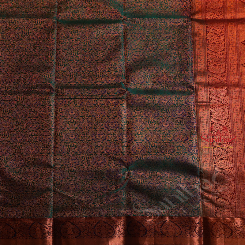 PEACOCK BLUE COLOUR BODY WITH JACQUARD FLORAL EMBOSED WITH CONTRAST BLOUSE & BORDER