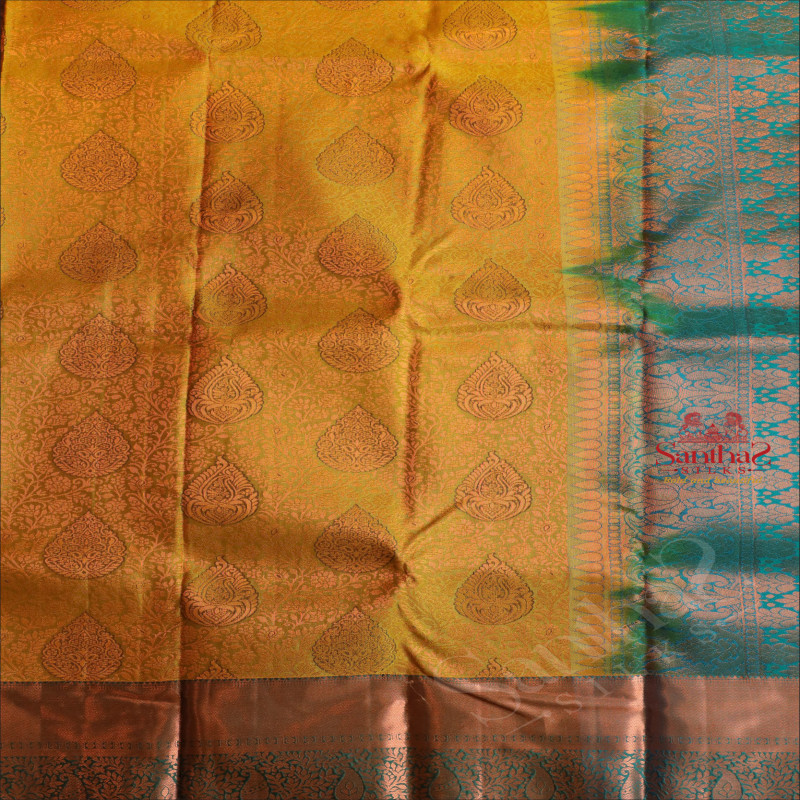 MEHANDI GREEN COLOUR BODY WITH JACQUARD FLORAL EMBOSED WITH CONTRAST BLUE BLOUSE & BORDER