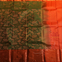 JADE GREEN COLOUR BODY WITH JACQUARD FLORAL EMBOSED IN COPPER ZARI WITH CONTRAST RED BLOUSE & BORDER