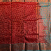 MAROON COLOUR BODY WITH JACQUARD FLORAL EMBOSED IN COPPER ZARI WITH CONTRAST BLUE BLOUSE & BORDER