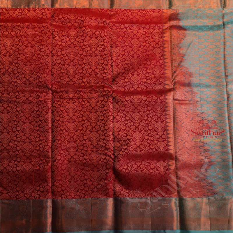 MAROON COLOUR BODY WITH JACQUARD FLORAL EMBOSED IN COPPER ZARI WITH CONTRAST BLUE BLOUSE & BORDER