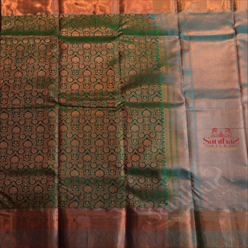 DARK GREEN COLOUR BODY WITH JACQUARD FLORAL EMBOSED IN COPPER ZARI WITH CONTRAST BLOUSE & BLUE BORDER