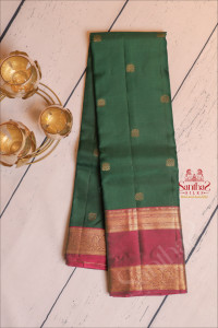 bottle-green-colour-body-with-golden-zari-floral-butta-with-contrast-blouse-border