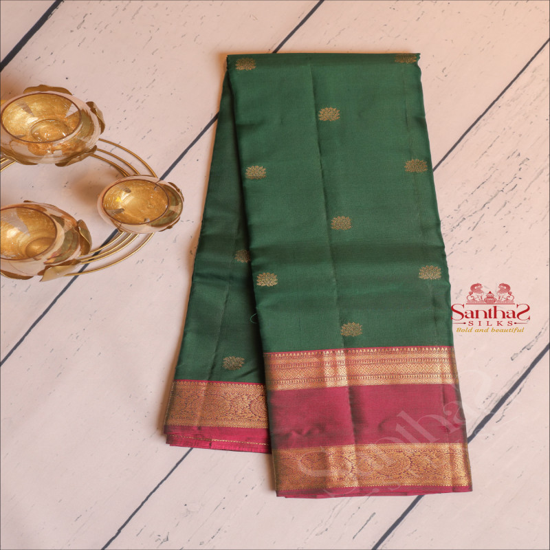 BOTTLE GREEN COLOUR BODY WITH GOLDEN ZARI FLORAL BUTTA WITH CONTRAST BLOUSE & BORDER