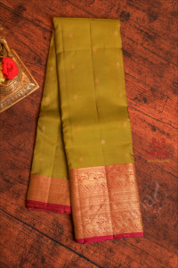 sheen-green-colour-body-with-golden-zari-buttas-and-contrast-pallu-blouse