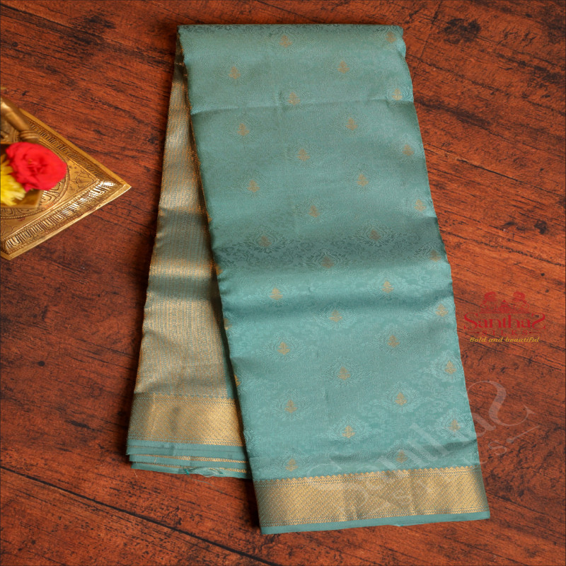 JUNGLE GREEN COLOUR BODY WITH BANARAS EMBOSED DESIGN AND SELF COLOUR PALLU & BLOUSE