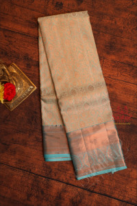 ice-blue-colour-body-with-jacquard-floral-embosed-with-copper-zari-border-and-contrast-blouse