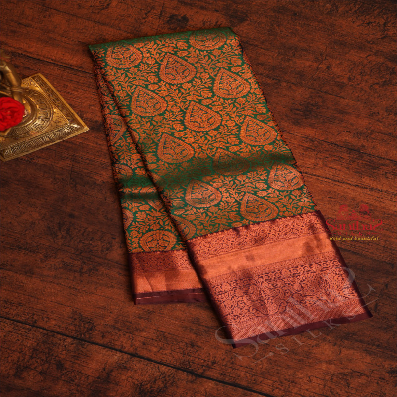 GREEN COLOUR BODY WITH JACQUARD FLORAL EMBOSED WITH CONTRAST MAROON BLOUSE & BORDER