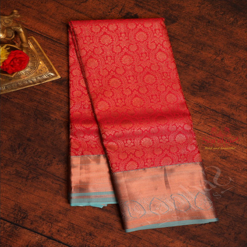 REDISH PINK COLOUR BODY WITH JACQUARD FLORAL EMBOSED WITH CONTRAST BLOUSE & BORDER