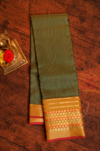 cadmium-green-colour-body-with-golden-zari-strips-and-contrast-pallu-blouse
