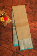 METALIC COPPER COLOUR BODY WITH STRIPS & BUTTAS AND CONTRAST PALLU & BLOUSE