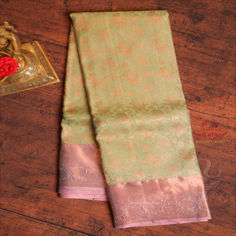 ELACHI GREEN COLOUR BODY WITH JACQUARD FLORAL EMBOSED WITH CONTRAST BLOUSE & BORDER