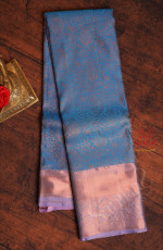 BLUE COLOUR BODY WITH JACQUARD FLORAL EMBOSED IN COPPER ZARI WITH CONTRAST BLOUSE & BORDER