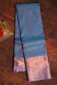 blue-colour-body-with-jacquard-floral-embosed-in-copper-zari-with-contrast-blouse-border